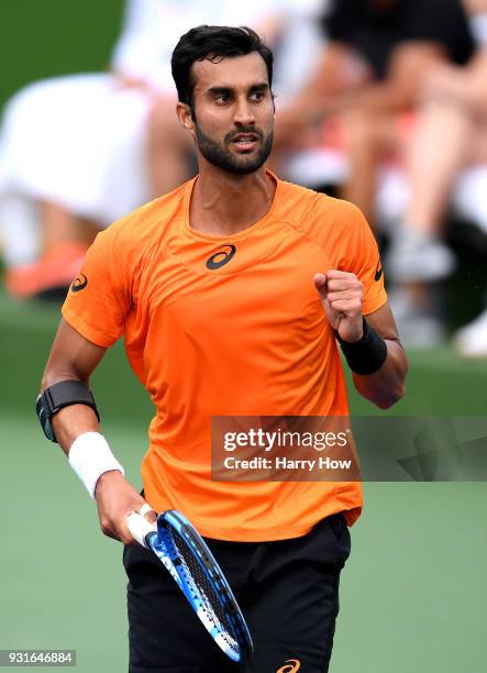 Yuki Bhambri of India reacts to set point in his match against Sam Querrey of the United States during the BNP Paribas Open at the Indian Wells...