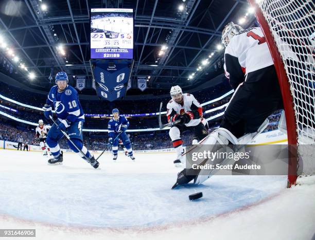 Miller of the Tampa Bay Lightning schools the puck for a goal against goalie Mike Condon of the Ottawa Senators during the second period at Amalie...