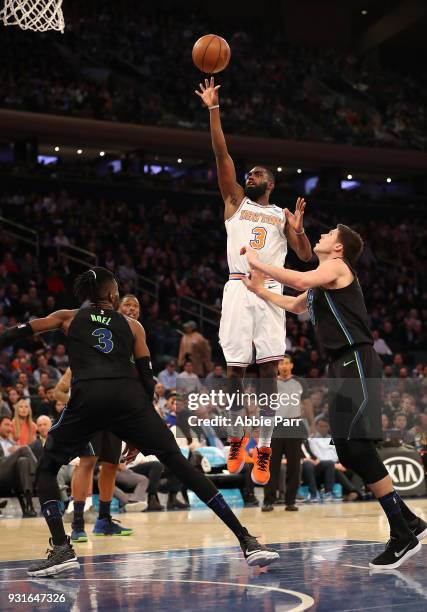 Tim Hardaway Jr. #3 of the New York Knicks takes a shot against Nerlens Noel of the Dallas Mavericks in the second half during their game at Madison...