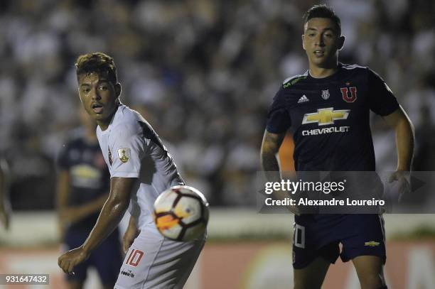 Evander of Vasco da Gama struggles for the ball with Rodrigo EcheverrÃ­a of Universidad de Chile during a Group Stage match between Vasco and...