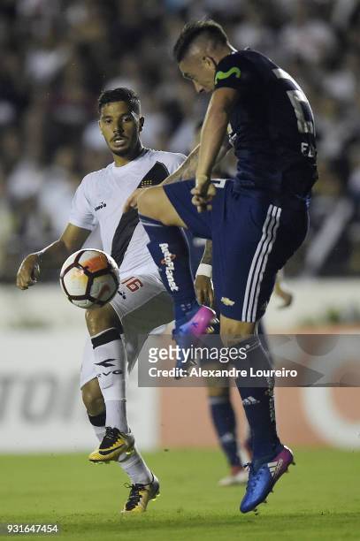 Henrique of Vasco da Gama struggles for the ball with Rodrigo EcheverrÃ­a of Universidad de Chile during a Group Stage match between Vasco and...