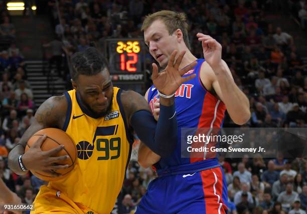 Jae Crowder of the Utah Jazz tries to get around the defense of Luke Kennard of the Detroit Pistons in the first half during a game at Vivint Smart...