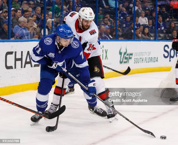 Anthony Cirelli of the Tampa Bay Lightning against Zack Smith of the Ottawa Senators during the third period at Amalie Arena on March 13, 2018 in...