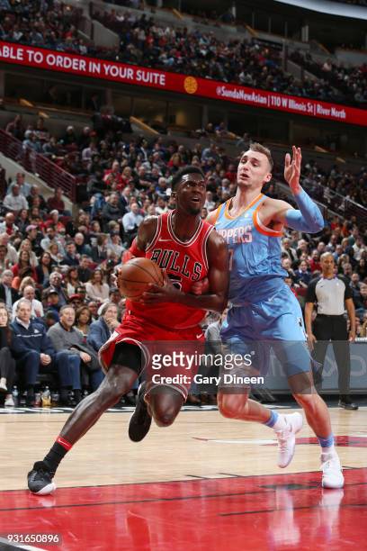 Bobby Portis of the Chicago Bulls handles the ball against Sam Dekker of the LA Clippers on March 13, 2018 at the United Center in Chicago, Illinois....