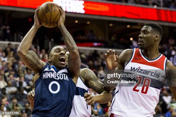 March 13: Minnesota Timberwolves Jeff Teague tries to get past Washington Wizards Bradley Beal and Ian Mahinmi at the Capital One Arena in...