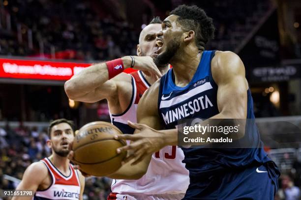 March 13: Minnesota Timberwolves Karl-Anthony Towns tries to get past Washington Wizards Marcin Gortat at the Capital One Arena in Washington, USA on...