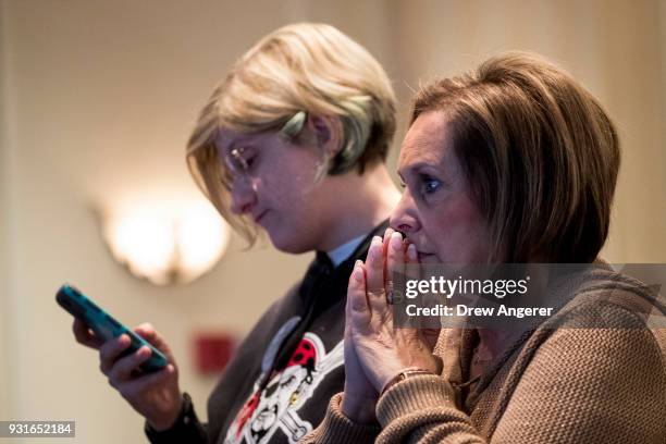 Supporters monitor election returns at an election night event for Conor Lamb, Democratic congressional candidate for Pennsylvania's 18th district,...