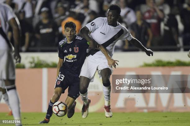 Paulao of Vasco da Gama struggles for the ball with Angelo Araos of Universidad de Chile during a Group Stage match between Vasco and Universidad de...