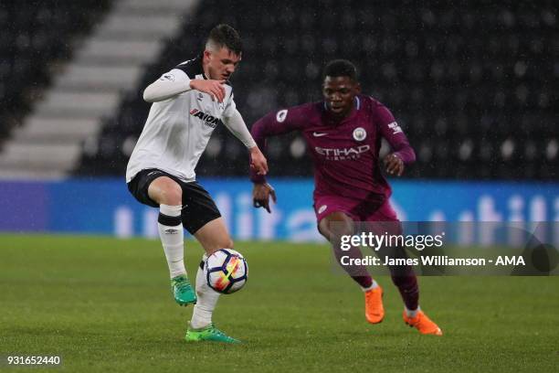 Jason Knight of Derby County and Tom Dele-Bashiru of Manchester City during the Premier League 2 match between Derby County and Manchester City on...
