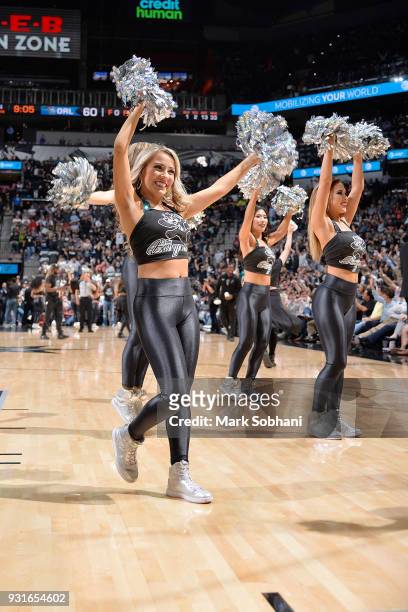The San Antonio Spurs dance team celebrate during the game against the Orlando Magic on March 13, 2018 at the AT&T Center in San Antonio, Texas. NOTE...