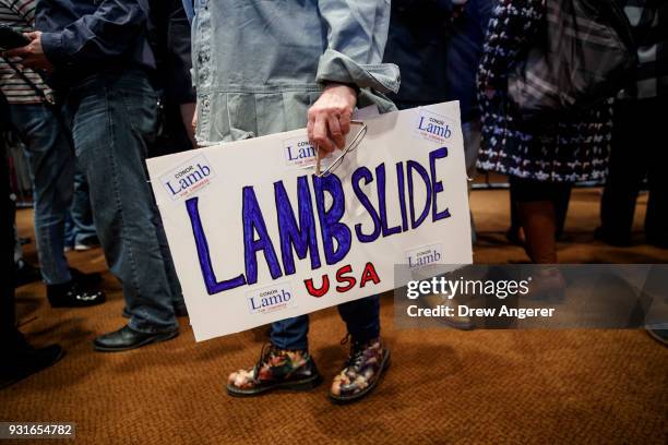 Supporter holds a sign in support of Conor Lamb, Democratic congressional candidate for Pennsylvania's 18th district, at an election night event for...