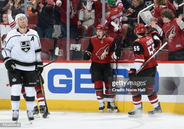 Clayton Keller of the Arizona Coyotes celebrates with teammate Jason Demers after his first period goal against the Los Angeles Kings at Gila River...