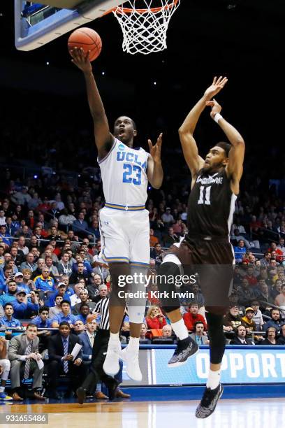 Prince Ali of the UCLA Bruins is pursued by Courtney Stockard of the St. Bonaventure Bonnies during the second half of the First Four game in the...