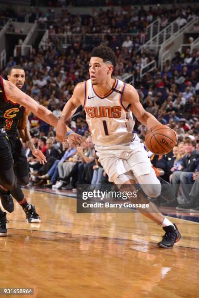 Devin Booker of the Phoenix Suns handles the ball against the Cleveland Cavaliers on March 13, 2018 at Talking Stick Resort Arena in Phoenix,...
