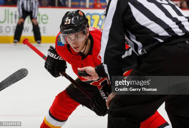 Sean Monahan of the Calgary Flames prepares to face off against the Edmonton Oilers at Scotiabank Saddledome on March 13, 2018 in Calgary, Alberta,...