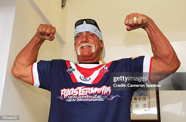 Wrestler Hulk Hogan flexes his muscles during a media opportunity with Sydney Roosters players at Roosters Headquarters on November 18, 2009 in...