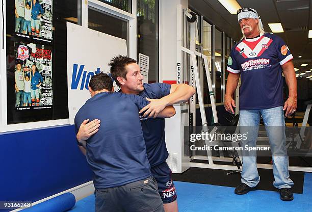 Wrestler Hulk Hogan watches Roosters players Anthony Minichiello and Mitchell Pearce wrestle during a media opportunity with Sydney Roosters players...