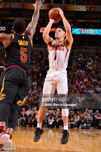 Devin Booker of the Phoenix Suns shoots the ball against the Cleveland Cavaliers on March 13, 2018 at Talking Stick Resort Arena in Phoenix, Arizona....