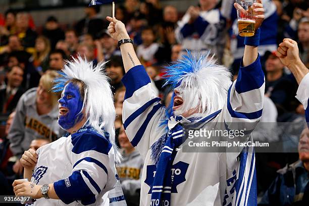 Two lively fans of the Toronto Maple Leafs celebrate a goal against the Ottawa Senators in a game at Scotiabank Place on November 17, 2009 in Ottawa,...