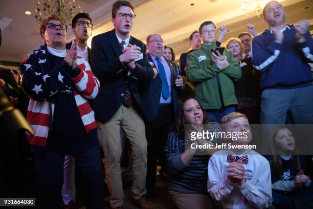 Anticipation builds among as they watch early election results at an Election Night event for GOP PA Congressional Candidate Rick Saccone as the...