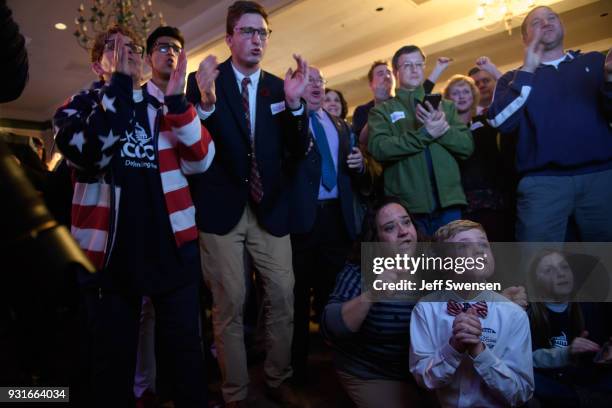 Anticipation builds among as they watch early election results at an Election Night event for GOP PA Congressional Candidate Rick Saccone as the...