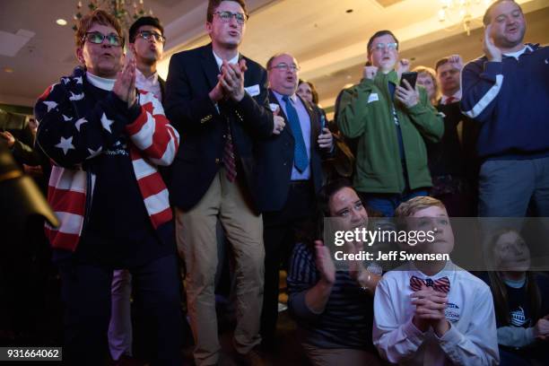 Anticipation builds among as they watch early election results at an Election Night event for GOP PA Congressional Candidate Rick Saccone as the...