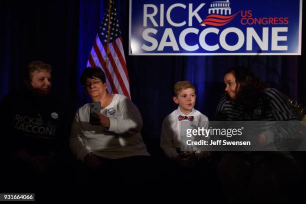 Aidan Davis waits with his aunt, Becky Kohut, for election results at an Election Night event for GOP PA Congressional Candidate Rick Saccone as the...