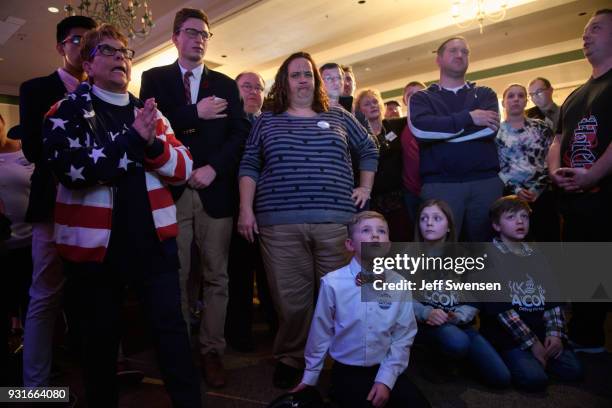 Anticipation builds among as they watch early election results at an Election Night event for GOP PA Congressional Candidate Rick Saccone as the...