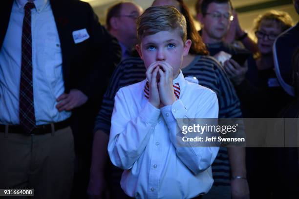 Aidan Davis watches election results at an Election Night event for GOP PA Congressional Candidate Rick Saccone as the polls close on March 13, 2018...