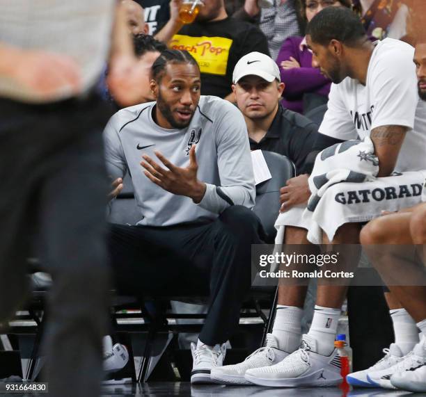 Kawhi Leonard of the San Antonio Spurs still not playing talks with teammate LaMarcus Aldridge of the San Antonio Spurs during game against the...