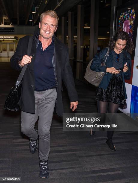 Actor Dolph Lundgren and Jenny Sandersson are seen arriving at Philadelphia International Airport on March 13, 2018 in Philadelphia, Pennsylvania.