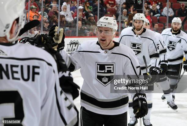 Tanner Pearson of the Los Angeles Kings is congratulated by teammates after his second period goal against the Arizona Coyotes at Gila River Arena on...