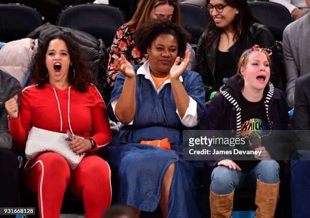 Dasha Polanco, Adrienne C. Moore and Emma Myles attend the New York Knicks Vs Dallas Mavericks game at Madison Square Garden on March 13, 2018 in New...