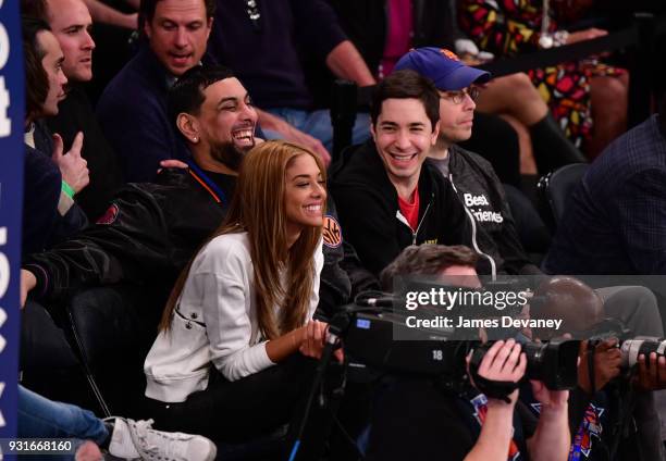 Heidi Dela Rosa and Justin Long attend the New York Knicks Vs Dallas Mavericks game at Madison Square Garden on March 13, 2018 in New York City.