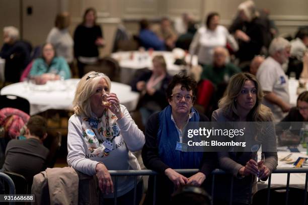 Attendees stand during an election night rally for Conor Lamb, Democratic candidate for the U.S. House of Representatives, not pictured, in...