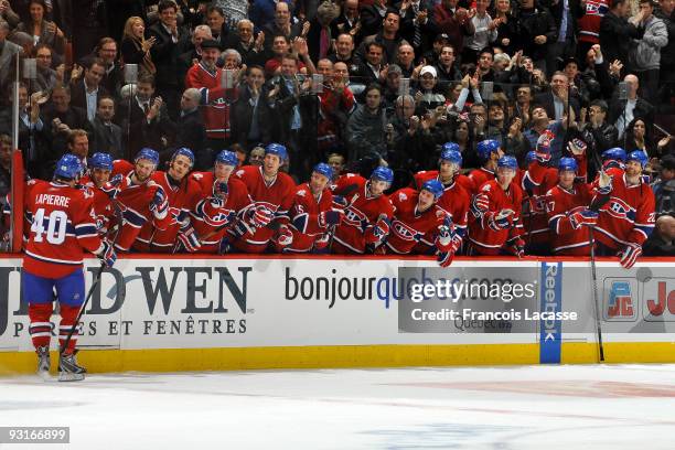 Maxim Lapierre of the Montreal Canadiens and teammate celebrates the winning goal during the NHL game against the Carolina Hurricanes on November 17,...