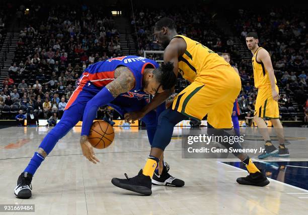 Eric Moreland of the Detroit Pistons and Ekpe Udoh of the Utah Jazz fight for the ball in the second half of a game at Vivint Smart Home Arena on...