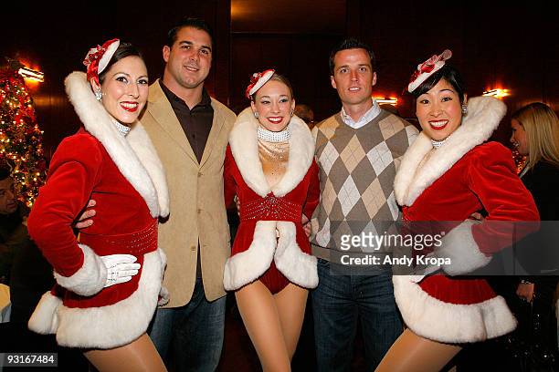 New York Giants football players Zak DeOssie and Lawrence Tynes with Radio City Rockettes Alyssa Epstein, Miki Berg and Lisa Matsuoka attend the...
