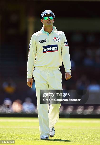 Michael Clarke of the Blues walks to the outfield during day two of the Sheffield Shield match between the New South Wales Blues and the Tasmanian...