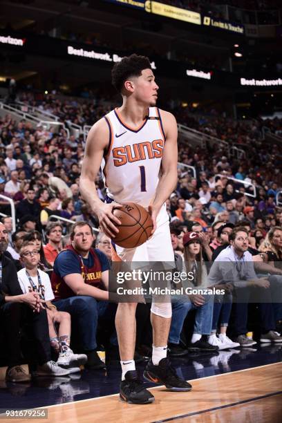 Devin Booker of the Phoenix Suns handles the ball against the Cleveland Cavaliers on March 13, 2018 at Talking Stick Resort Arena in Phoenix,...