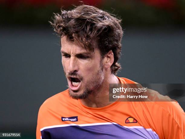 Feliciano Lopez of Spain reacts to his win of the fifth game in the third set on his way to victory over Jack Sock of the United States during the...