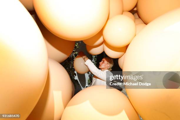 Balloon designer Jihan Zencirli, aka Geronimo, works on her installation for Melbourne Design Week 2018 on March 14, 2018 in Melbourne, Australia....