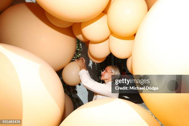 Balloon designer Jihan Zencirli, aka Geronimo, works on her installation for Melbourne Design Week 2018 on March 14, 2018 in Melbourne, Australia....