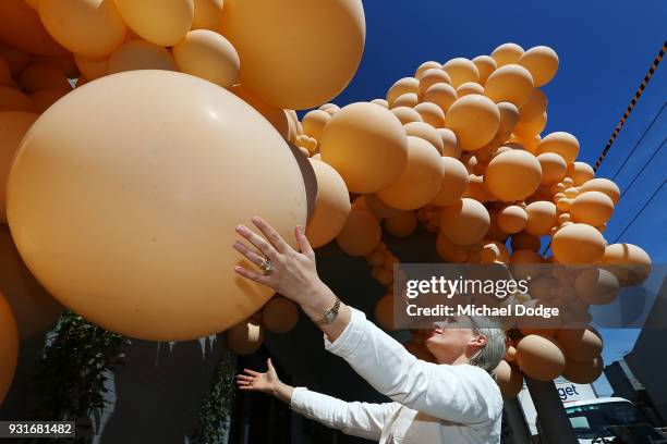 Balloon designer Jihan Zencirli, aka Geronimo, attends to her installation for Melbourne Design Week 2018 on March 14, 2018 in Melbourne, Australia....