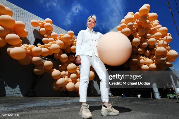 Balloon designer Jihan Zencirli, aka Geronimo, poses with her installation for Melbourne Design Week 2018 on March 14, 2018 in Melbourne, Australia....