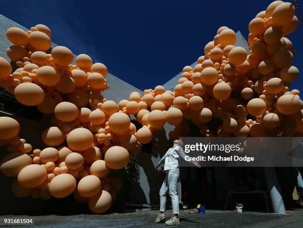 Balloon designer Jihan Zencirli, aka Geronimo, poses with her installation for Melbourne Design Week 2018 on March 14, 2018 in Melbourne, Australia....