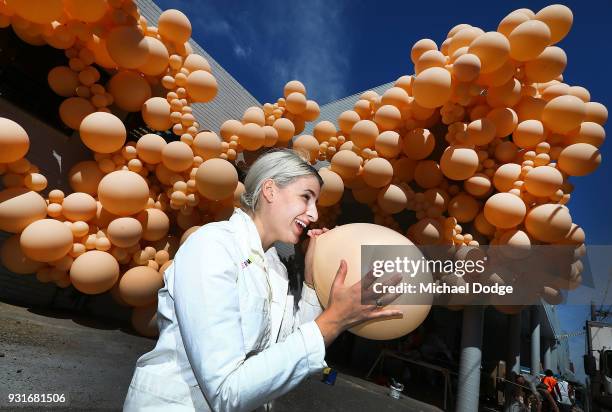 Balloon designer Jihan Zencirli, aka Geronimo, poses with her installation for Melbourne Design Week 2018 on March 14, 2018 in Melbourne, Australia....