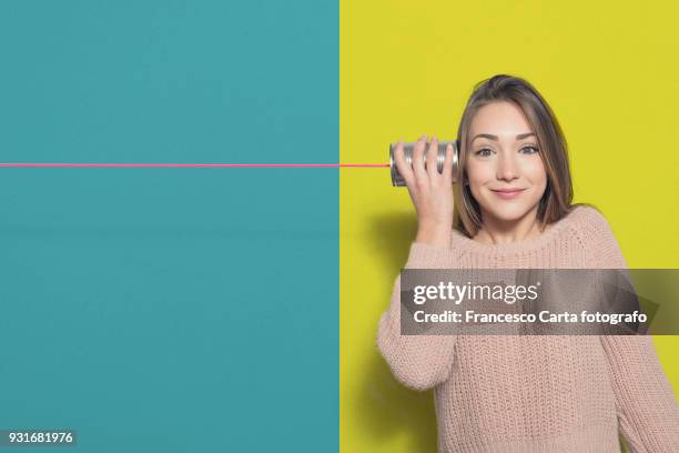 secret and gossip on the phone - luisteren stockfoto's en -beelden