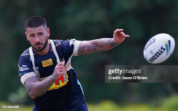 Nathan Peats passes the ball during a Gold Coast Titans NRL training session at Parkwood on March 14, 2018 in Gold Coast, Australia.