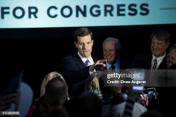 Conor Lamb, Democratic congressional candidate for Pennsylvania's 18th district, greets supporters at an election night rally March 14, 2018 in...